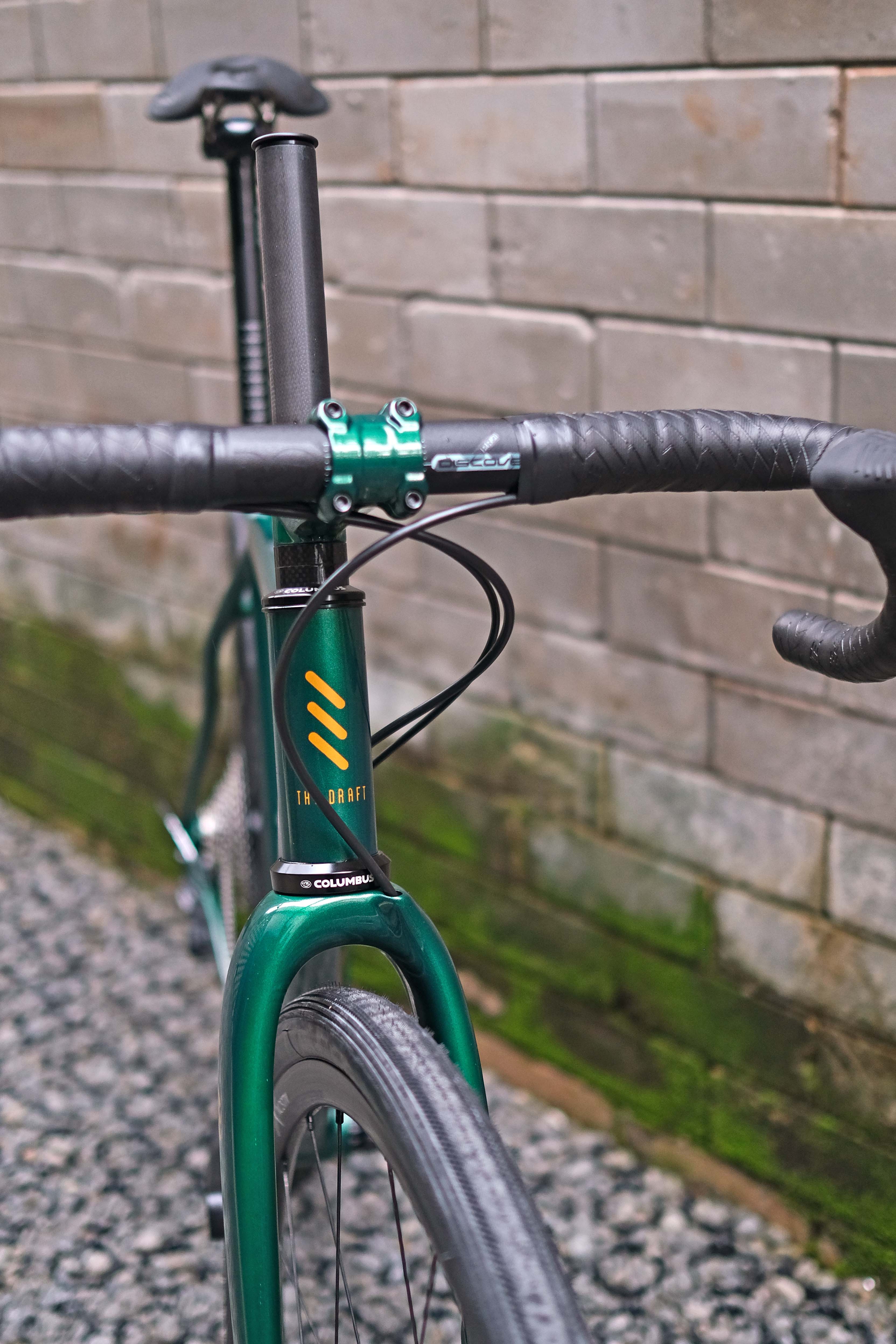 dark green gravel bike The Draft Comet Eater Gravel Bike