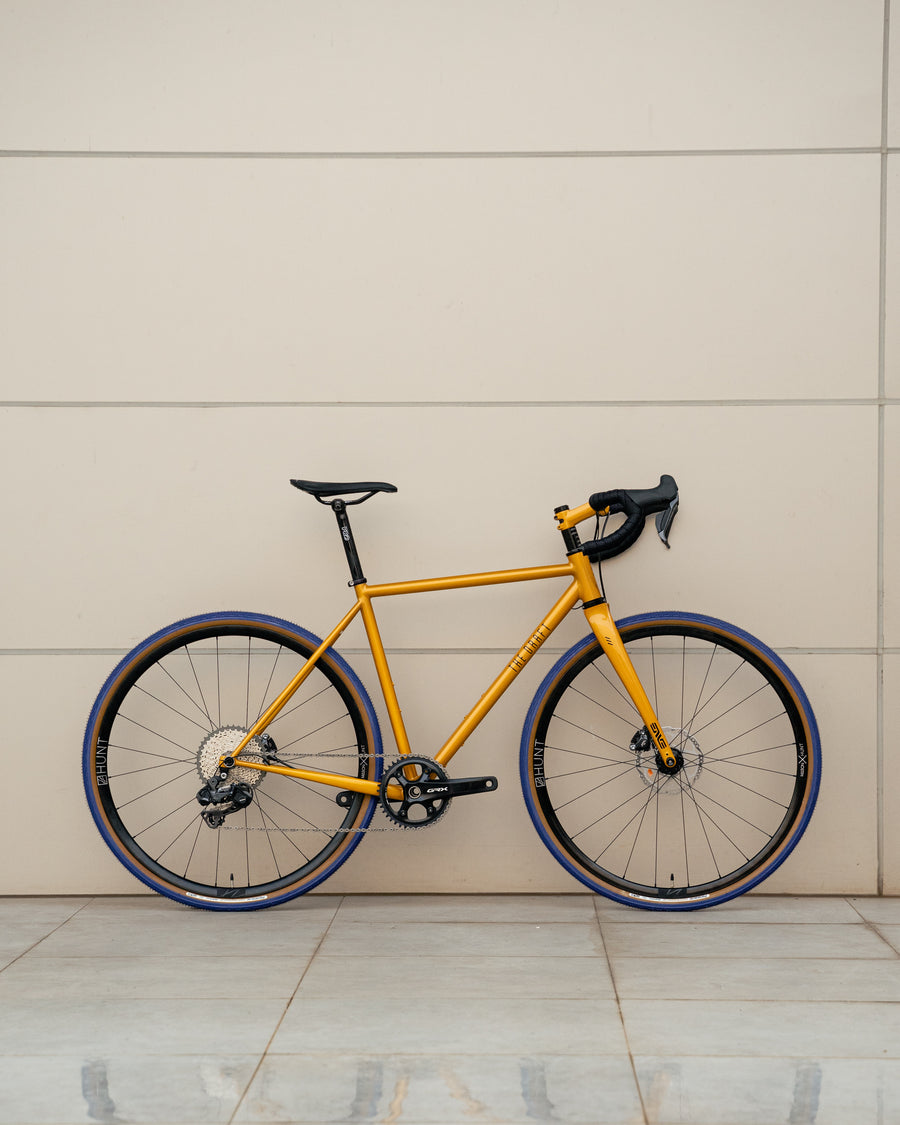 gravel bike gold The Draft Comet Eater Gravel Bike